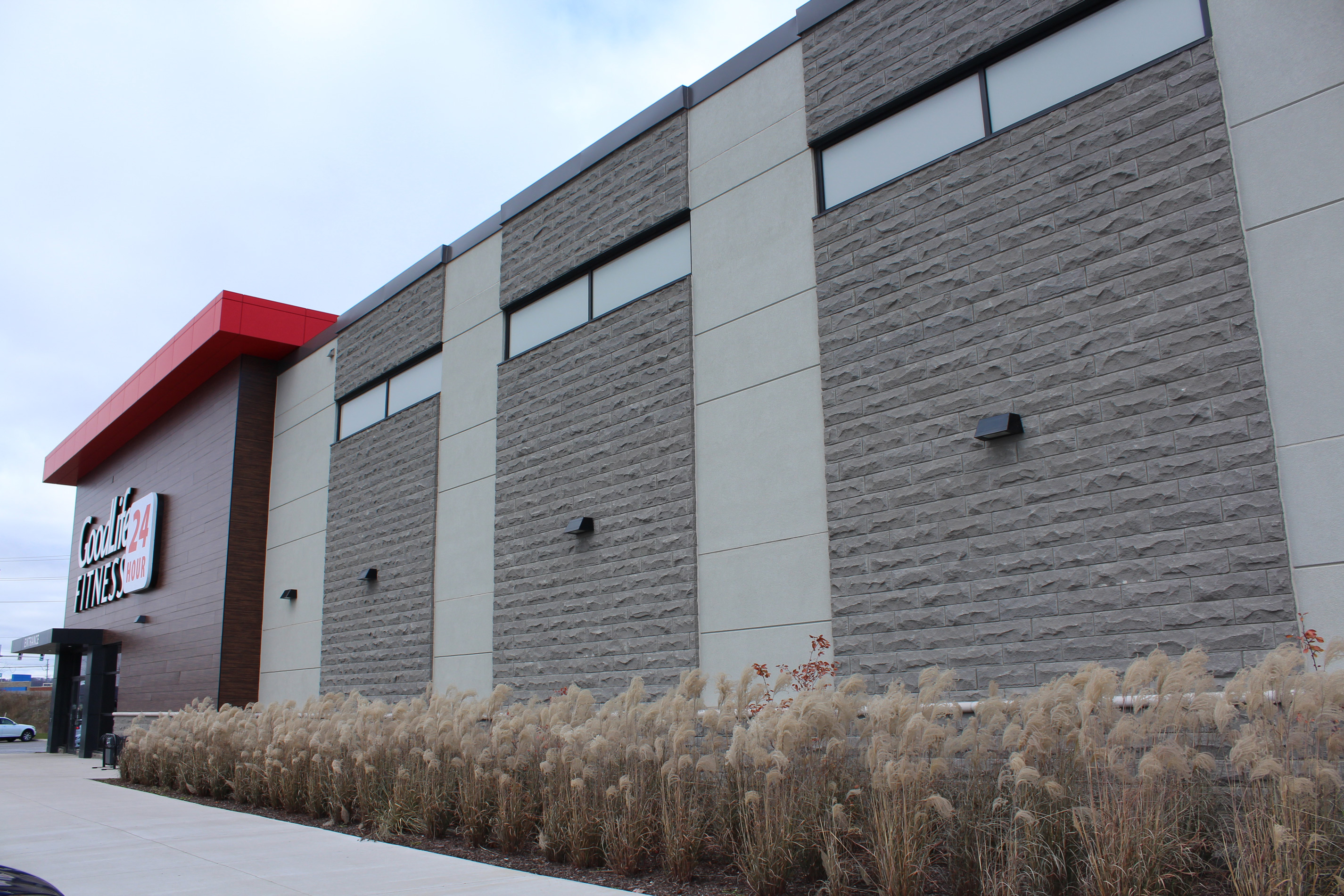 Angled side shot of Goodlife Fitness building - Stone colour Carbon