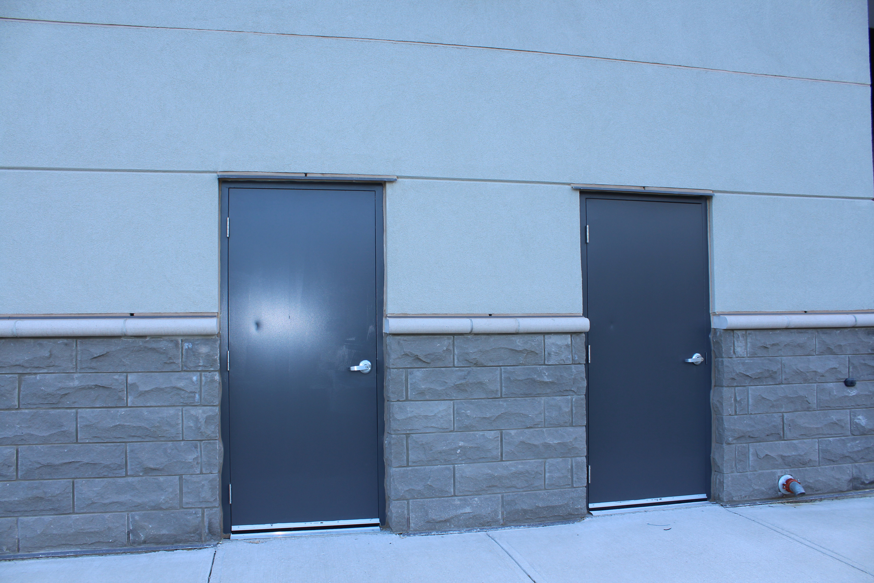 Back door shot of Goodlife Fitness building - Stone colour Carbon