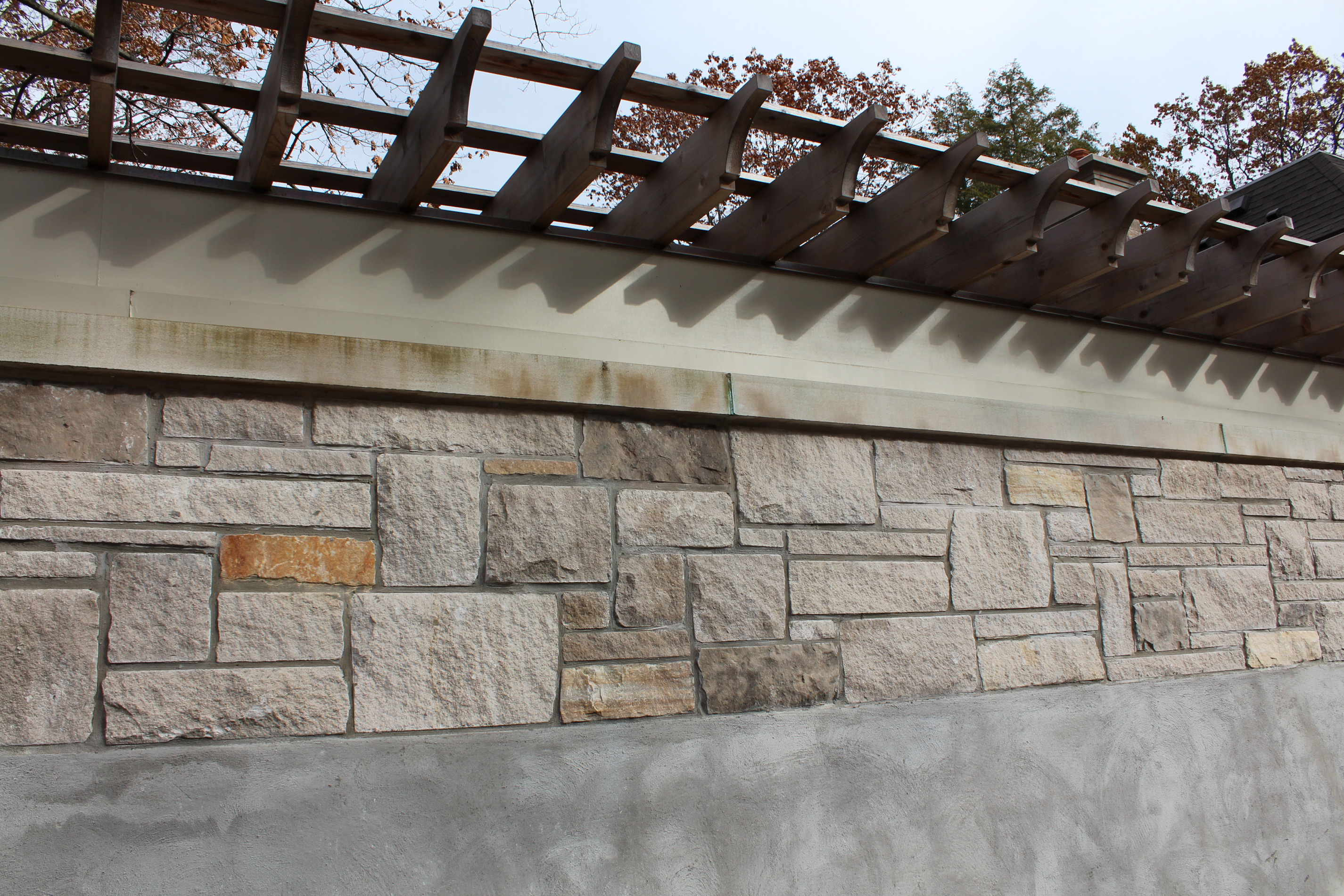Backyard stone wall - Stone colour is Eramosa Saw Cut