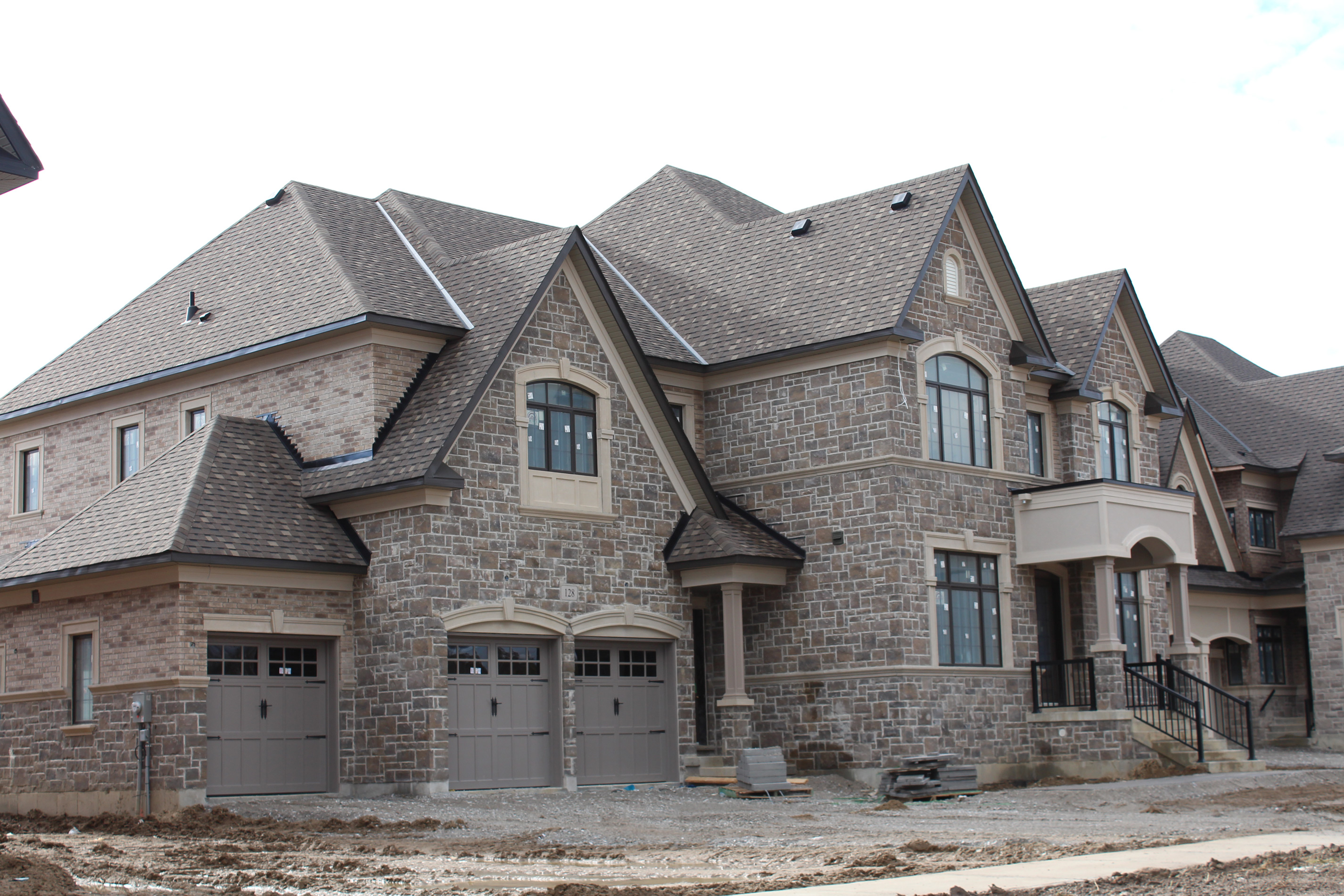 Wide shot of residential home. - Brick color is Caldonia, Stone color is Berkeley brown.