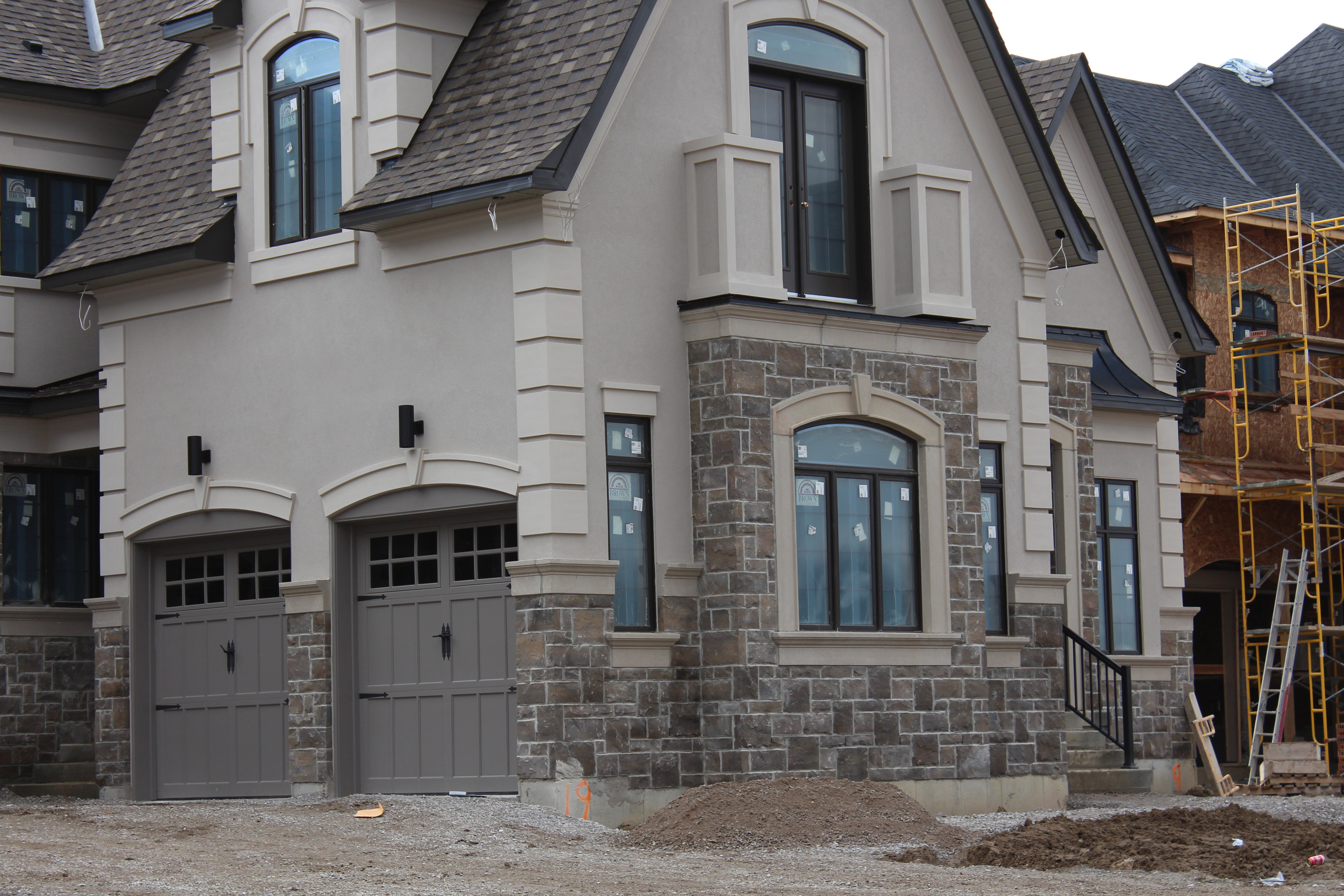Angled wide shot of residential home - Stone color is Berkeley Brown.