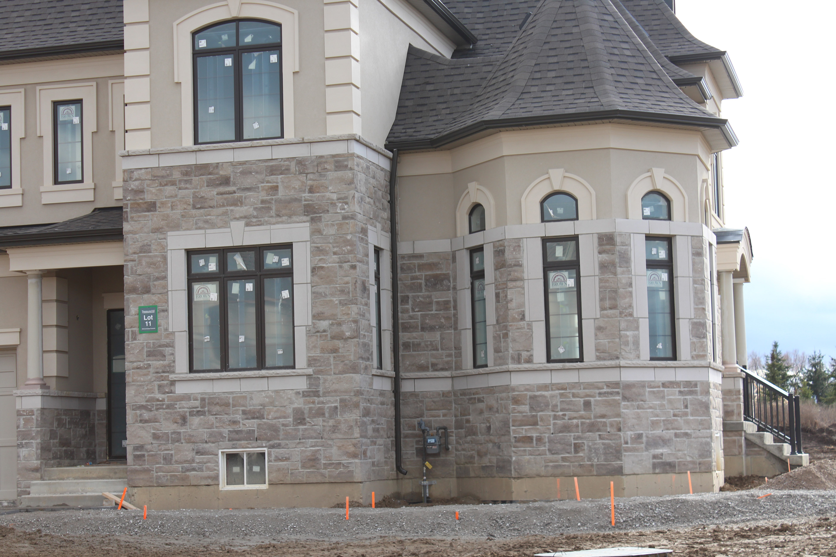 Side view of a residential house - Stone color is Berkeley brown.