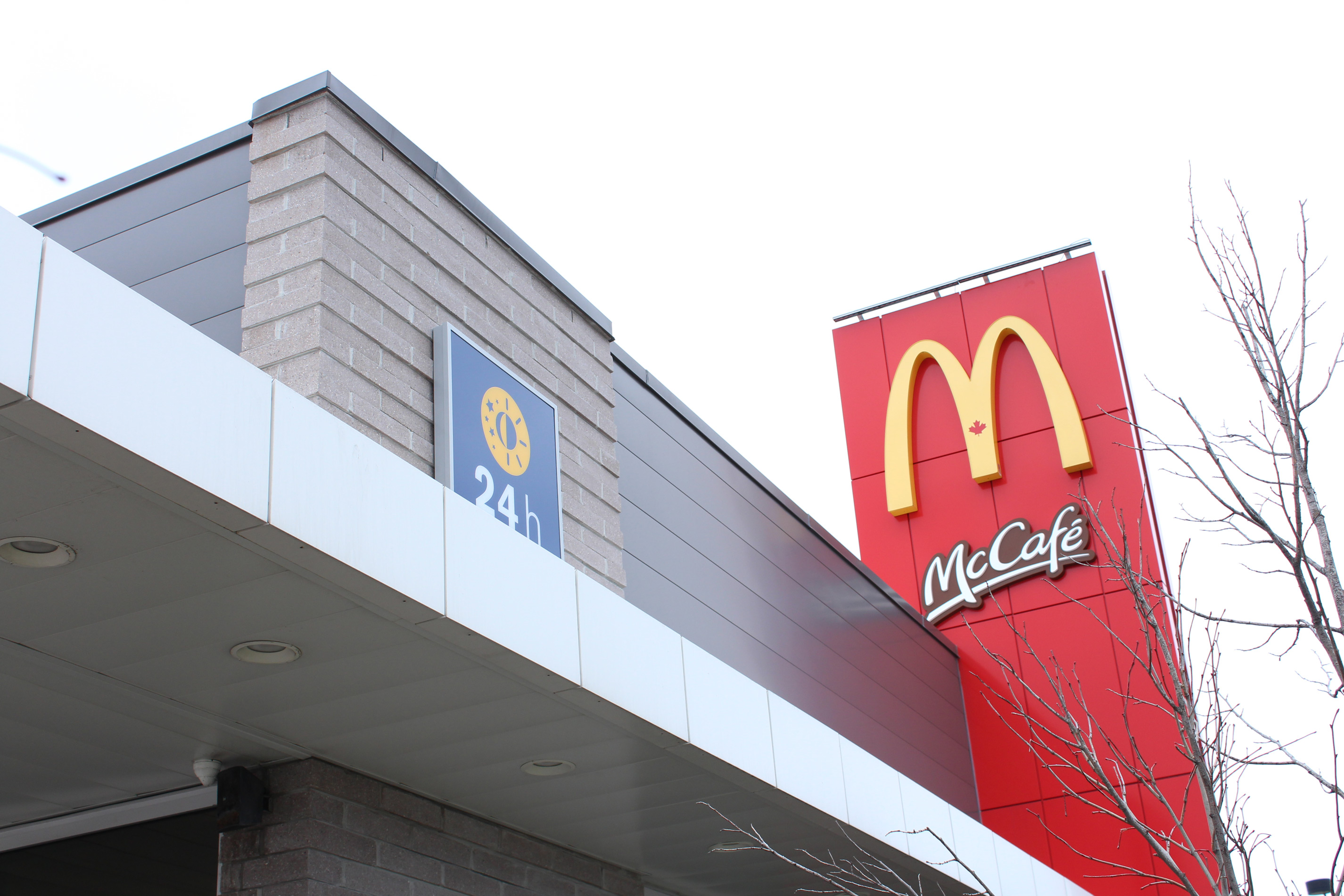 Close-up shot of McDonald's building and logo - Block colour Dover Grey / Diamond Black