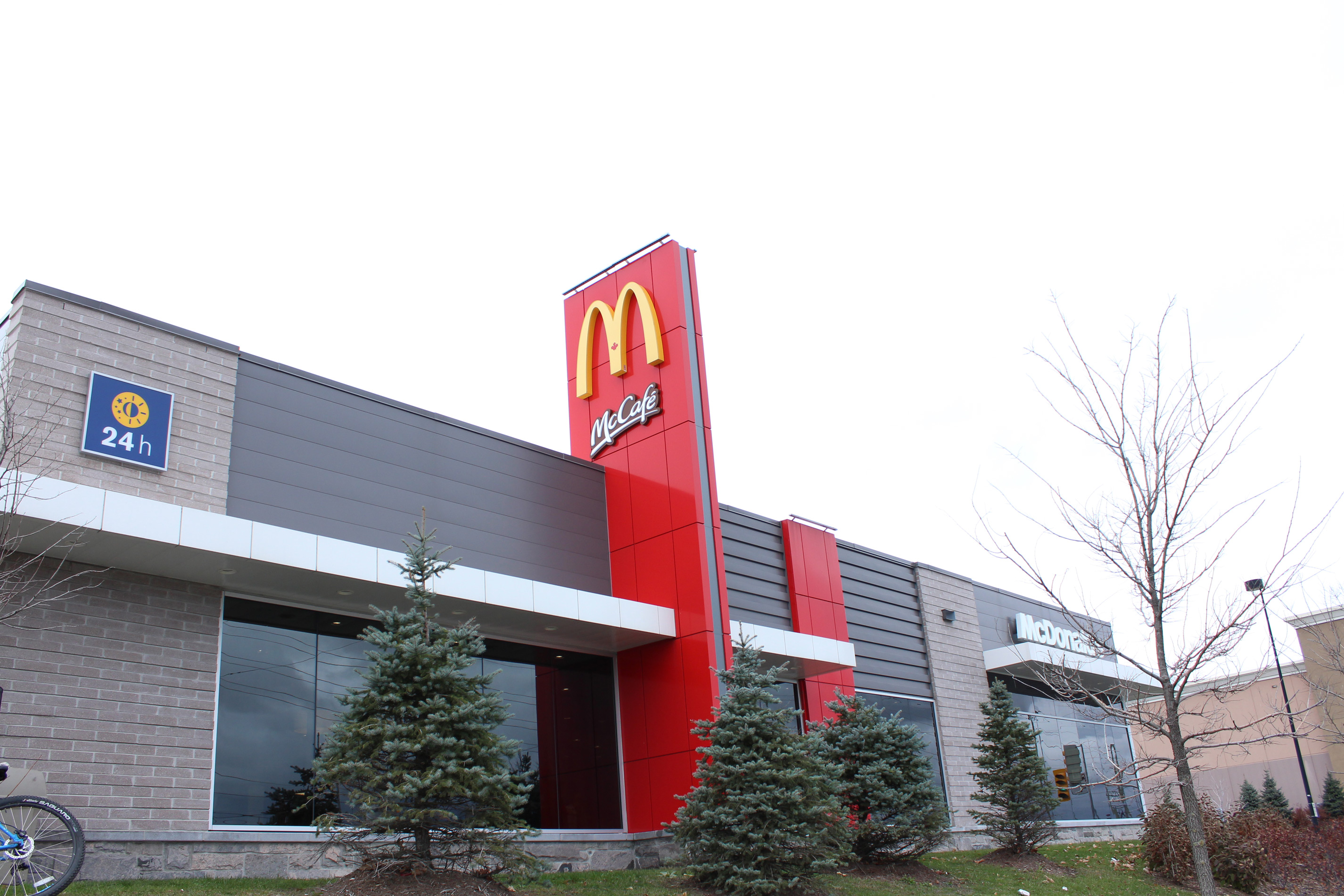 Angled shot of McDonald's building and logo - Block colour Dover Grey / Diamond Black