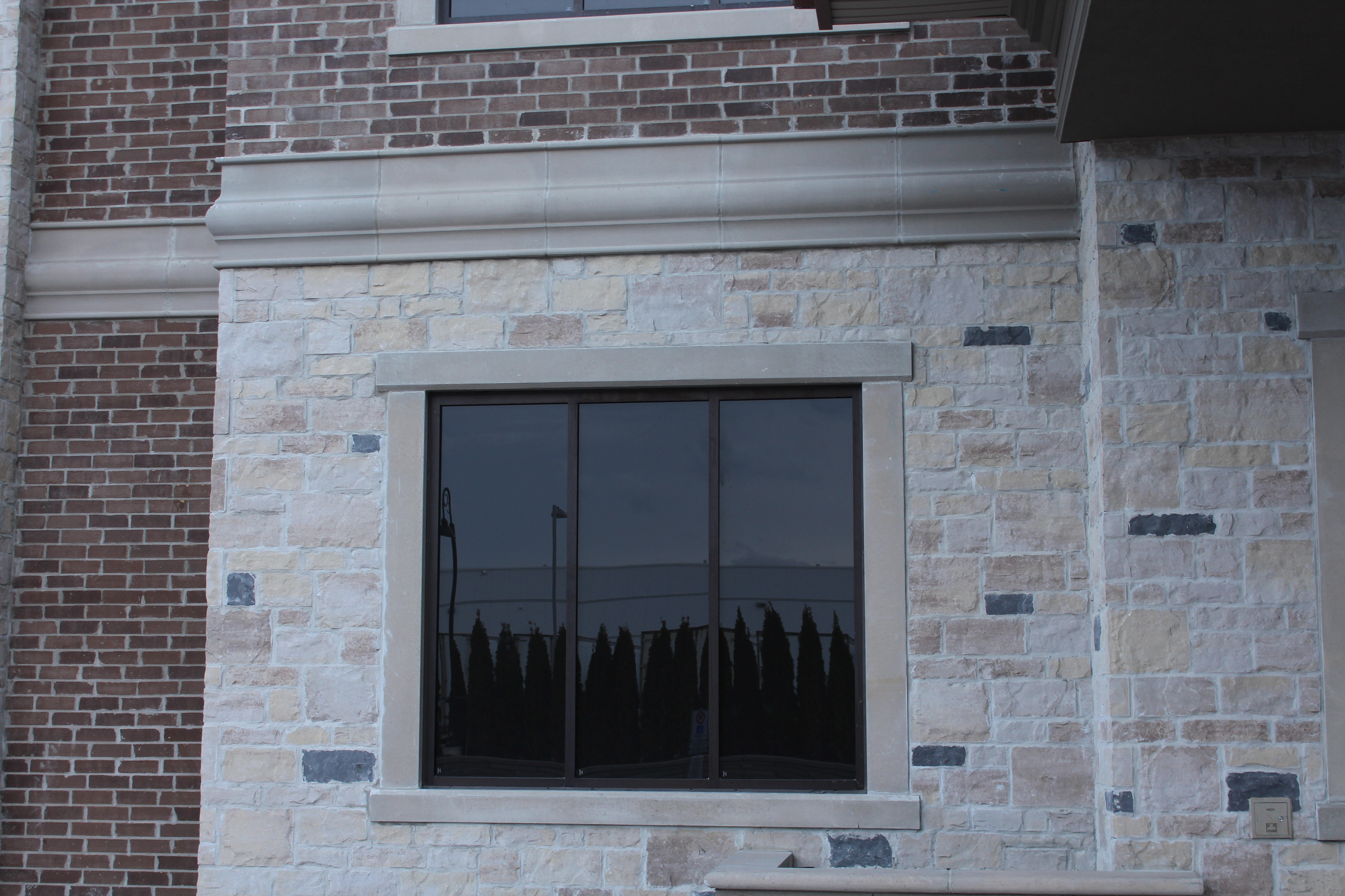Close up of building. - Stone colour is Vivace Milano, Brick colour is Sierra Brown