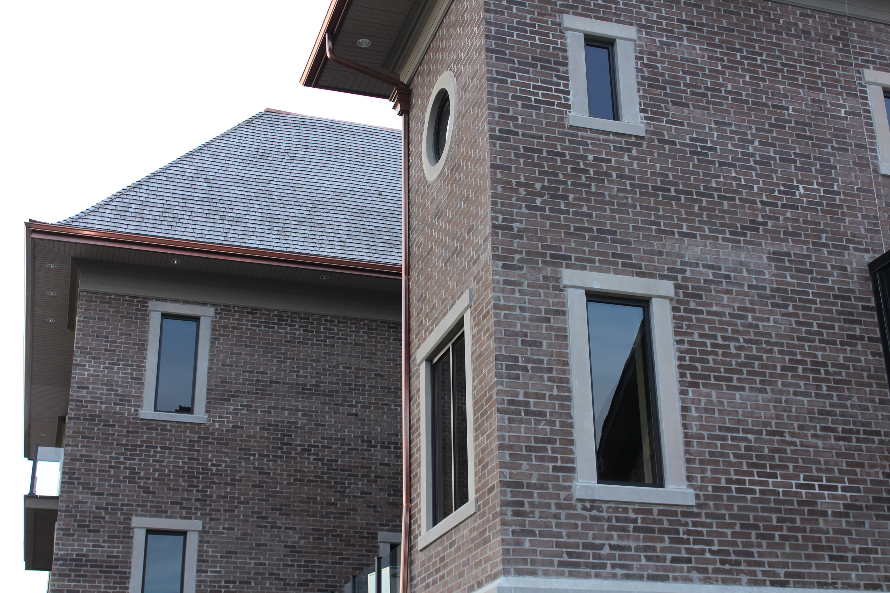 Upward side shot of building. - Brick colour is Sierra Brown