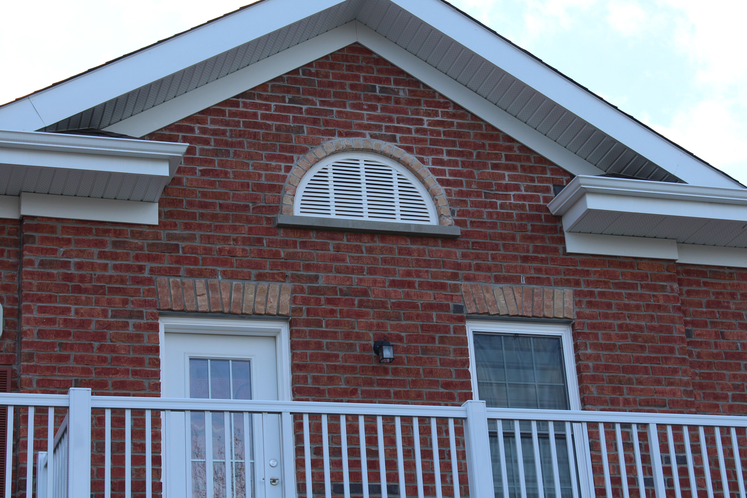 Close-up shot of main building veranda- Brick color is Olde Huron with Olde Cambridge accent